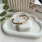 Gold cuff bracelet scattered with dainty white pearls – Pearl Speckle Cuff by Uptown Accessories